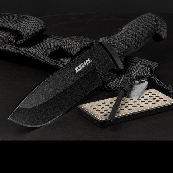 Schrade Frontier fixed blade knife with 1095 steel drop point blade, textured TPE handle, lanyard hole, sheath, and ferro rod.